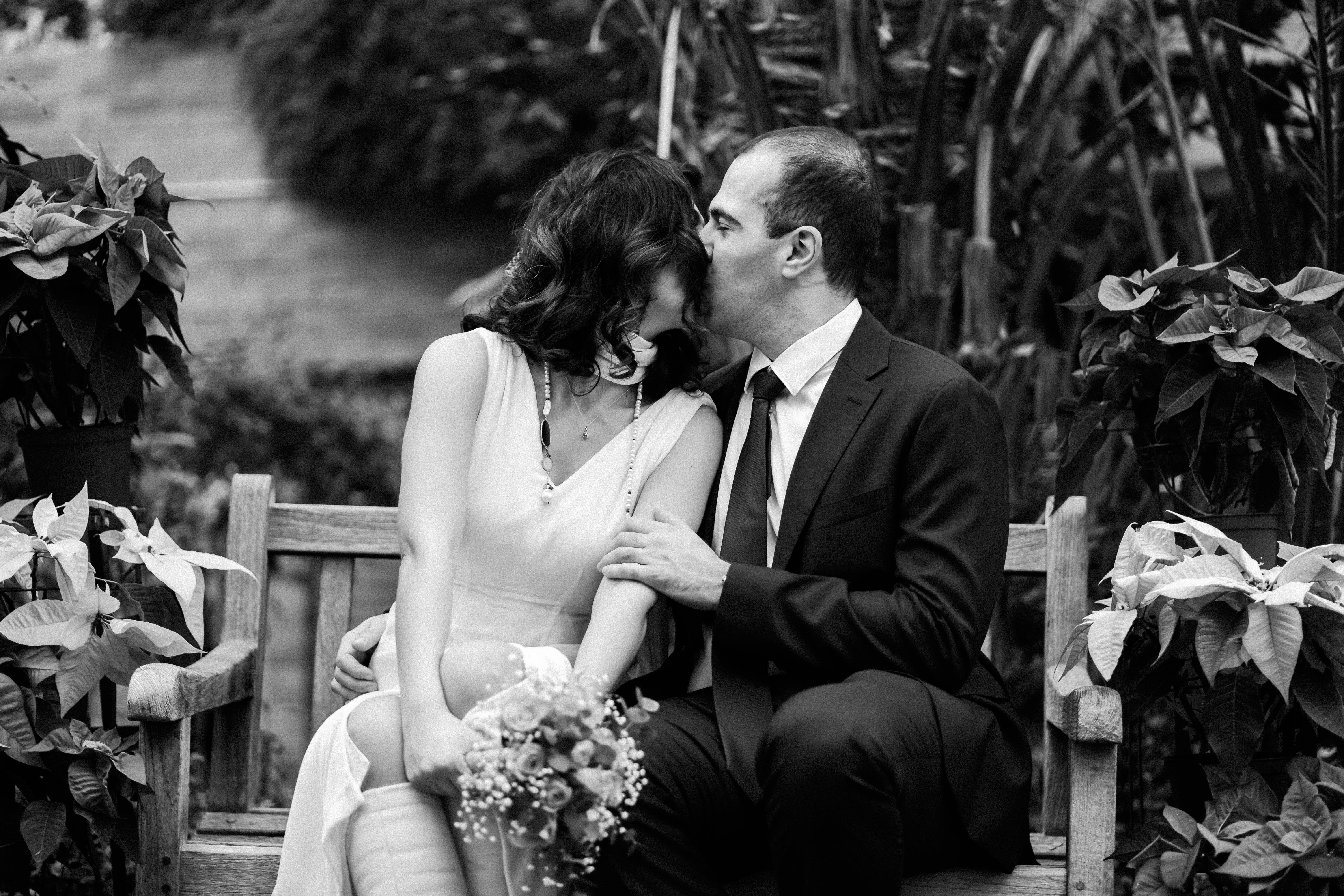 A couple kissing at their wedding